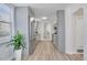 Modern kitchen with gray cabinets, stainless steel appliances, and plenty of counter space with a window and views to a bedroom at 1601 Robb St, Lakewood, CO 80215