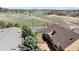 Aerial view of property featuring large green fields and mountain views at 1890 Bel Lago Vw, Monument, CO 80132