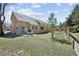 This backyard has a patio with a table and chairs and a fenced lawn at 1890 Bel Lago Vw, Monument, CO 80132