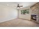Bedroom with stone fireplace, ceiling fan, recessed lights and a window with green tree views at 1890 Bel Lago Vw, Monument, CO 80132