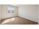 Carpeted bedroom featuring a window with grid panes and neutral paint at 1890 Bel Lago Vw, Monument, CO 80132