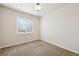 Clean and simple bedroom with large window allowing ample natural light at 1890 Bel Lago Vw, Monument, CO 80132