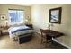 Serene bedroom with a queen bed, natural light, and cozy carpet at 1890 Bel Lago Vw, Monument, CO 80132