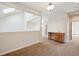 Bonus room featuring a skylight, railing, and wet bar with wooden cabinets at 1890 Bel Lago Vw, Monument, CO 80132