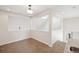 Carpeted bonus room featuring a skylight and a railing overlooking a lower level at 1890 Bel Lago Vw, Monument, CO 80132