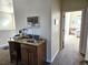 Hallway featuring a unique desk/vanity area leading into bedroom at 1890 Bel Lago Vw, Monument, CO 80132