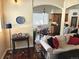 Cozy interior view showcasing living room, dining area, and kitchen with rich hardwood floors at 1890 Bel Lago Vw, Monument, CO 80132