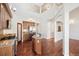 Bright, open kitchen with stainless steel appliances, granite counters, and hardwood floors at 1890 Bel Lago Vw, Monument, CO 80132