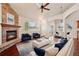 Spacious living room featuring vaulted ceilings, fireplace, and ample natural light at 1890 Bel Lago Vw, Monument, CO 80132