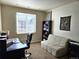 Functional office space with a desk, comfortable seating, and ample natural light at 1890 Bel Lago Vw, Monument, CO 80132