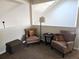 Cozy sitting area with comfortable armchairs and a side table at 1890 Bel Lago Vw, Monument, CO 80132