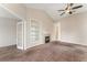 Inviting living room features carpeted floors, a cozy fireplace, and stylish built-in shelving at 13965 Adams St, Thornton, CO 80602