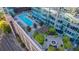 Aerial view of a rooftop pool, fire pit, and lounge area, showcasing upscale amenities at 1700 Bassett St # 513, Denver, CO 80202
