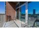 Exterior view of a balcony with seating and city views at 1700 Bassett St # 513, Denver, CO 80202