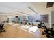 Bright workout room featuring rows of stationary exercise bikes and a large mirror at 1700 Bassett St # 513, Denver, CO 80202