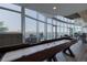 This game room has a shuffleboard table and floor-to-ceiling windows for entertainment and relaxation at 1700 Bassett St # 513, Denver, CO 80202