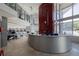 Modern gym reception area with sleek countertops and large windows with workout equipment visible at 1700 Bassett St # 513, Denver, CO 80202