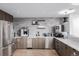 The community kitchen offers stainless steel appliances and modern fixtures for food preparation at 1700 Bassett St # 513, Denver, CO 80202