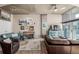 Cozy living room with plush seating, modern lighting, and access to the balcony at 1700 Bassett St # 513, Denver, CO 80202