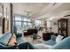 Spacious living room showcasing open layout, with large windows, and modern decor at 1700 Bassett St # 513, Denver, CO 80202