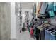 Organized walk-in closet with built-in shelving and clothing racks at 1700 Bassett St # 513, Denver, CO 80202