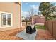 Paver patio with grill and daybed with privacy screens creating a space for relaxation and entertainment at 2208 S Eldridge Ct, Lakewood, CO 80228
