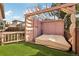 Outdoor space with daybed, featuring a modern design with pergola and privacy screen, enhancing outdoor living at 2208 S Eldridge Ct, Lakewood, CO 80228