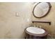 Charming powder room with rustic vanity, unique fixtures, and textured walls at 2208 S Eldridge Ct, Lakewood, CO 80228