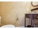 Charming powder room with rustic vanity, unique fixtures, and textured walls at 2208 S Eldridge Ct, Lakewood, CO 80228