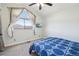 Bedroom features large window with neighborhood views at 2208 S Eldridge Ct, Lakewood, CO 80228