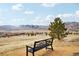 Benches offer an opportunity to relax and take in the mountain views on a neighborhood walking trail at 2208 S Eldridge Ct, Lakewood, CO 80228