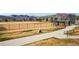 A baseball field sits beside a neighborhood walking path, offering spaces for activity at 2208 S Eldridge Ct, Lakewood, CO 80228