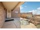 Welcoming front porch with brick accents, a decorative water feature, and a charming front door at 2208 S Eldridge Ct, Lakewood, CO 80228