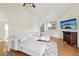 Bright living room with hardwood floors, vaulted ceilings, and a comfortable white sectional sofa at 2208 S Eldridge Ct, Lakewood, CO 80228