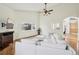 Bright living room features hardwood floors, large window, high ceilings, and modern white couch at 2208 S Eldridge Ct, Lakewood, CO 80228