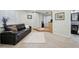 Inviting living room featuring a sofa, plush rug, and a stylish, contemporary aesthetic at 2208 S Eldridge Ct, Lakewood, CO 80228
