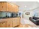 Spacious living room with wet bar and sofa, creating a comfortable and functional space at 2208 S Eldridge Ct, Lakewood, CO 80228