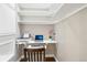 Cozy office space with built-in shelving, a dedicated workspace, and warm, neutral-toned walls at 2208 S Eldridge Ct, Lakewood, CO 80228