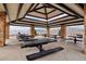 Open-air pavilion with multiple picnic tables, stone pillars, and mountain views, perfect for gatherings at 2208 S Eldridge Ct, Lakewood, CO 80228