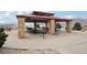 Community pavilion featuring stone columns, picnic tables, barbeque, and scenic mountain views at 2208 S Eldridge Ct, Lakewood, CO 80228