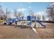 Blue and white playground structure with slides, ladders, and soft ground surface for safe play at 2208 S Eldridge Ct, Lakewood, CO 80228