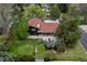 Aerial view of the property showcasing the home's layout, landscaping, and outdoor living spaces at 5880 S Happy Canyon Dr, Cherry Hills Village, CO 80111