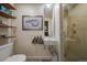 Modern bathroom featuring a floating sink, wall-mounted faucet, and sleek glass enclosed shower at 5880 S Happy Canyon Dr, Cherry Hills Village, CO 80111