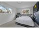 Minimalist bedroom featuring neutral décor, comfortable bedding, and lots of natural light at 5880 S Happy Canyon Dr, Cherry Hills Village, CO 80111