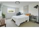 Clean bedroom featuring bright walls, natural lighting, desk, and modern décor at 5880 S Happy Canyon Dr, Cherry Hills Village, CO 80111