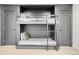 Bedroom featuring built-in bunk beds with clean design and soft neutral accents at 5880 S Happy Canyon Dr, Cherry Hills Village, CO 80111