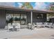 Stylish covered patio with a dining table and comfortable lounge seating, perfect for outdoor relaxation at 5880 S Happy Canyon Dr, Cherry Hills Village, CO 80111