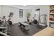 Home gym equipped with modern equipment and plenty of space for a complete workout at 5880 S Happy Canyon Dr, Cherry Hills Village, CO 80111