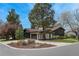Attractive home features an attached garage, mature trees, a well-manicured lawn, and a modern design at 5880 S Happy Canyon Dr, Cherry Hills Village, CO 80111