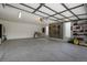 Spacious garage with ample storage, bike rack, and well-organized tool area at 5880 S Happy Canyon Dr, Cherry Hills Village, CO 80111